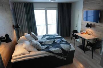 Фото номера Одноместный номер Делюкс с балконом Отель KIDE hotel by Iso-Syöte г. Сиоте 9