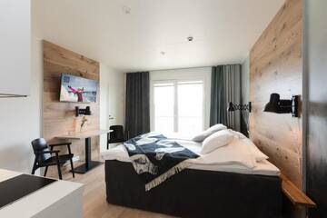 Фото номера Одноместный номер Делюкс с балконом Отель KIDE hotel by Iso-Syöte г. Сиоте 7